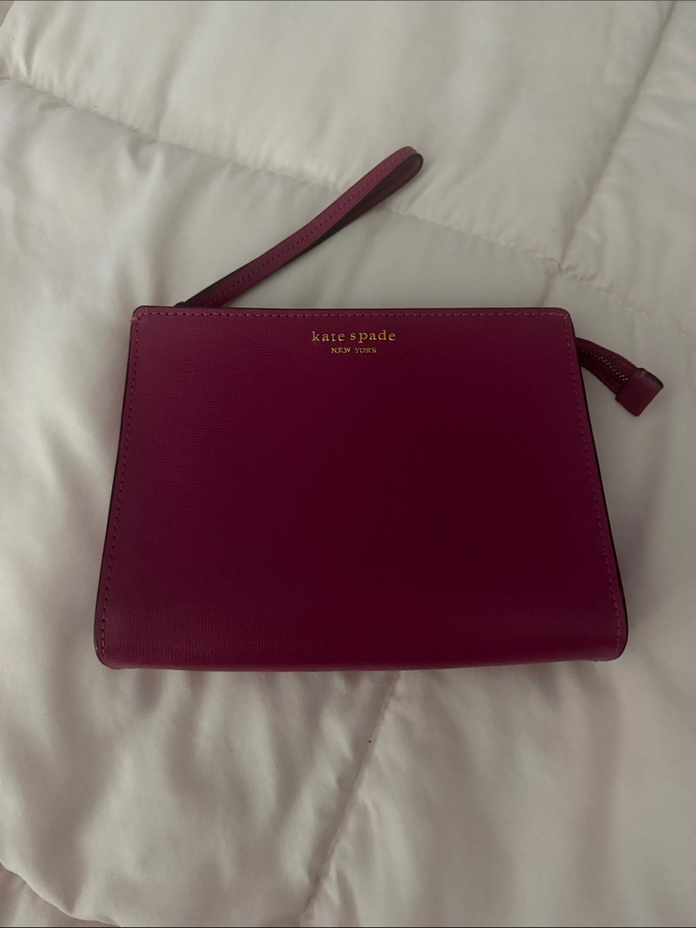 kate spade magenta wristlet clutch with gold logo